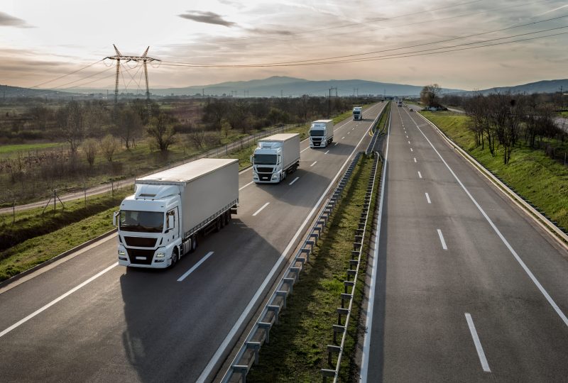 Caravan,Or,Convoy,Of,Trucks,In,Line,On,A,Country